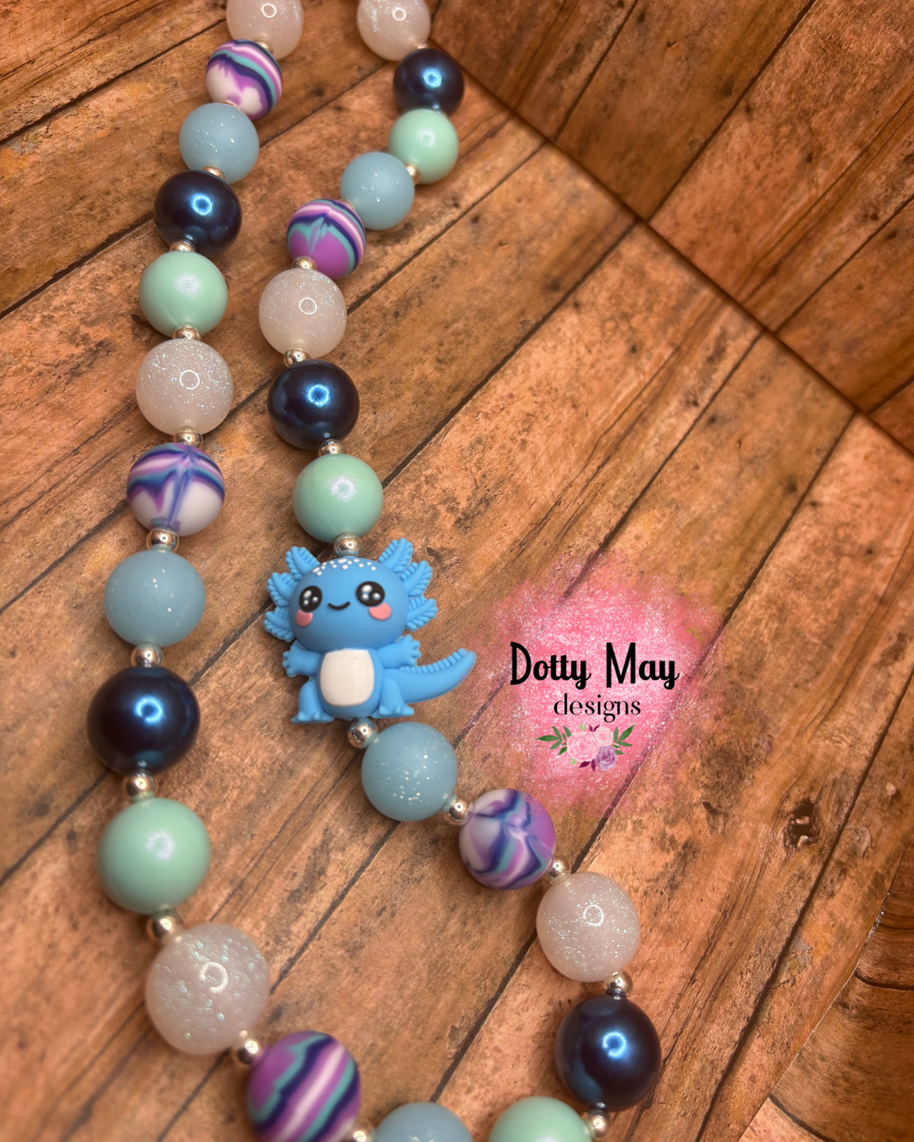 6a619c6ea15b5f2766344e95_blue-axlotl-chunky-necklace_1788219271023.png