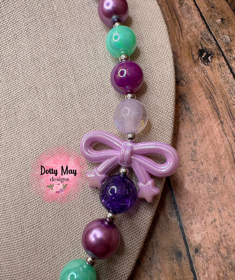 6a619c6ea15b5f2766344e95_bow-necklace-5-_1786410045740.png