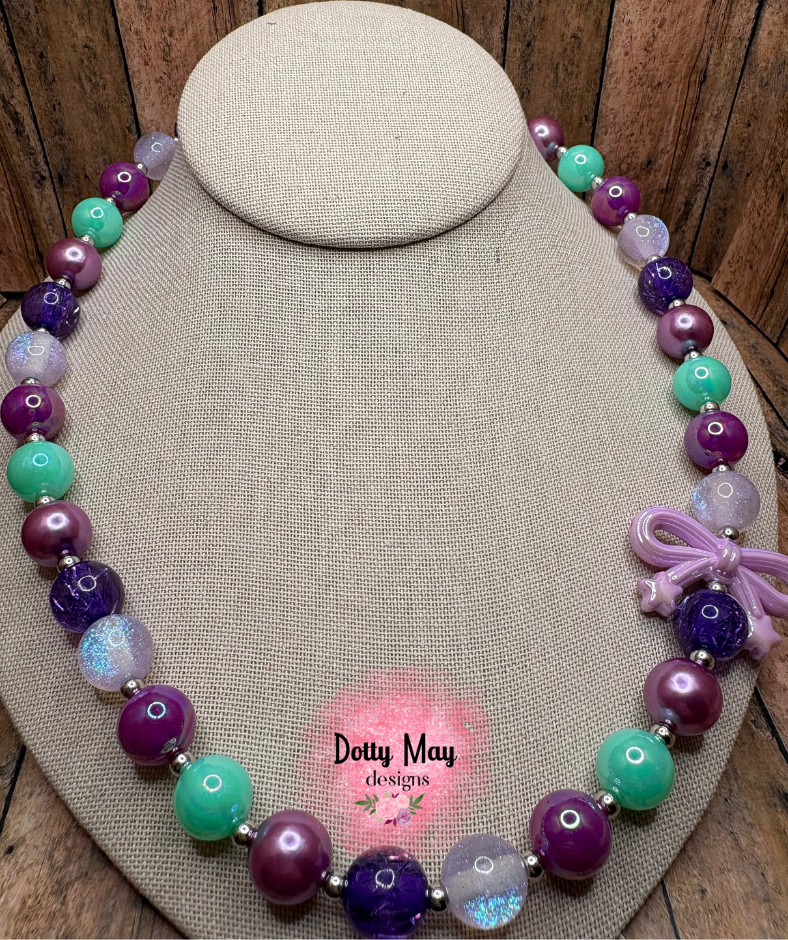 6a619c6ea15b5f2766344e95_bow-necklace-6-_1786410030444.png