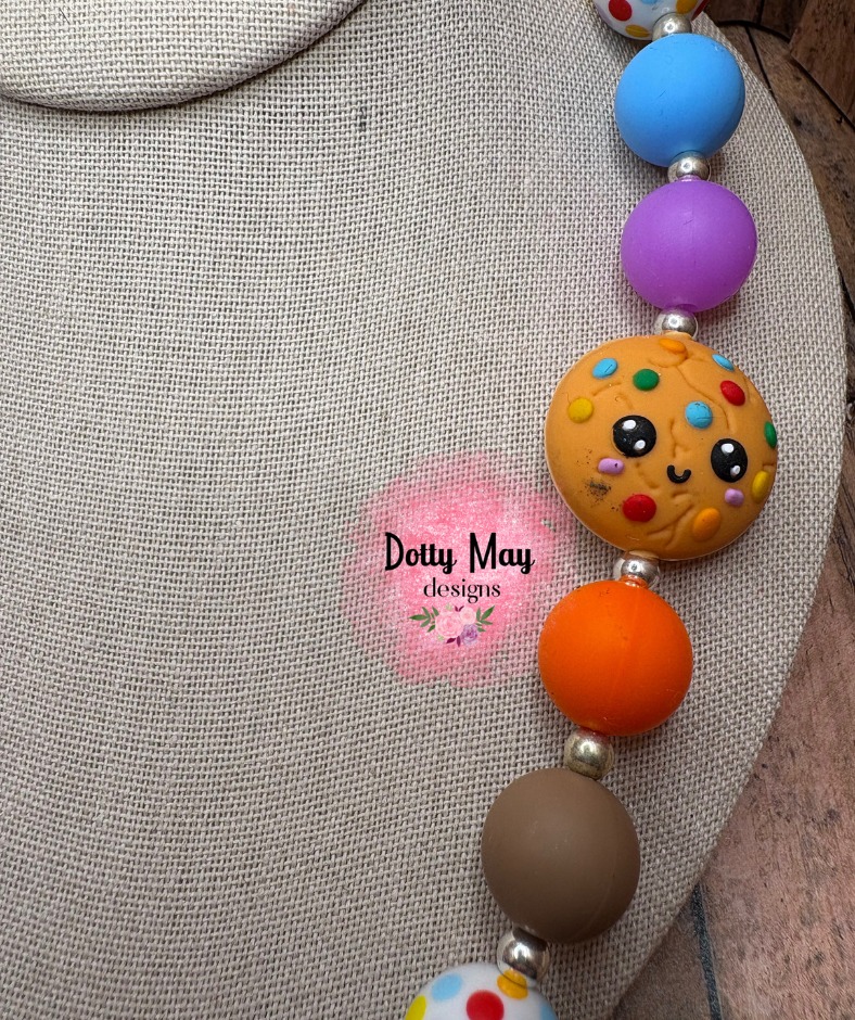 6a619c6ea15b5f2766344e95_cookie-necklace-2-_1786411115234.png