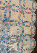 6a619c6ea15b5f2766344e95_wedding-ring-quilt_1786578440061.png